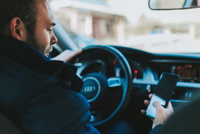 Can I hold a phone when I drive in Virginia